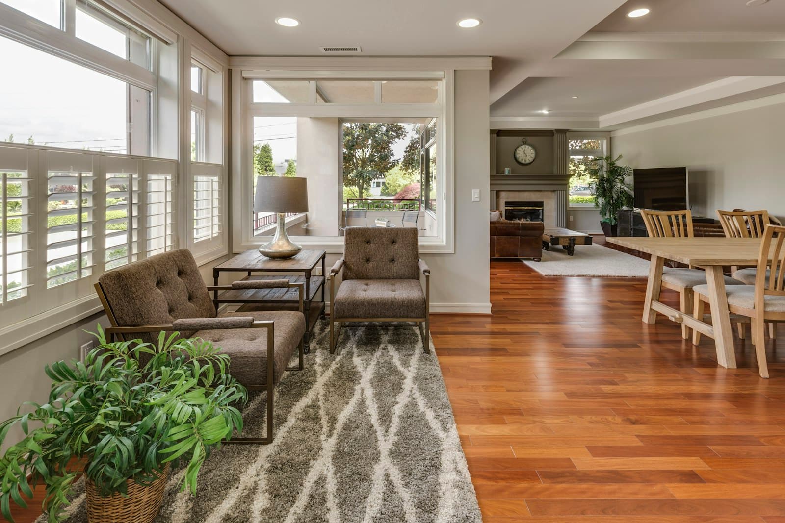 A bright, welcoming living room with a sofa, coffee table, and large window